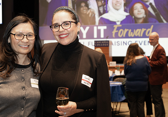 Sponsors smiling happily.