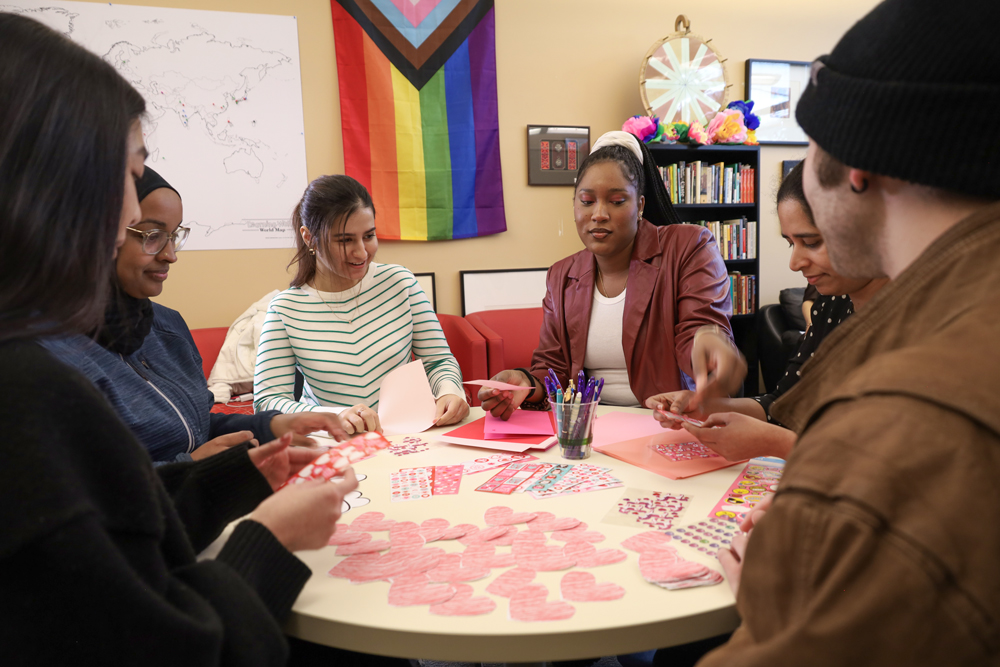 Center for Inclusion, Advocacy, and Community Students sitting around circular table making crafts in the Center for Inclusion, Advocacy, and Community