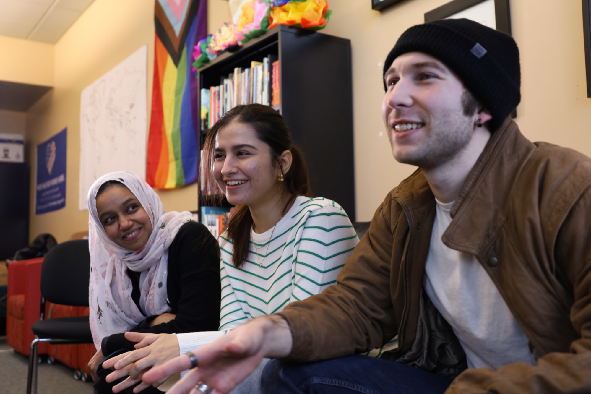 International student posing with a peace sign.