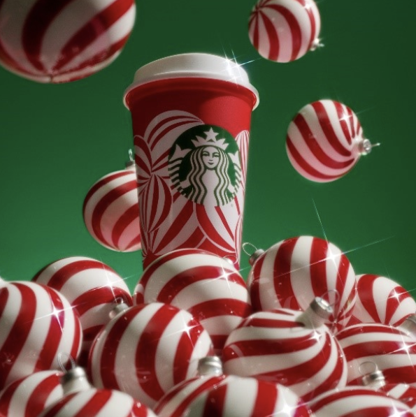 Starbucks cup Image of Starbuck cup in bright Christmas color of white and red with green logo of Starbucks.