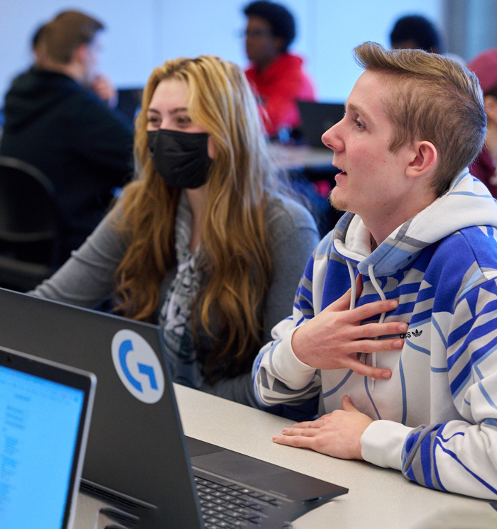 Student having conversation inside the classroom. Student having conversation inside the classroom.