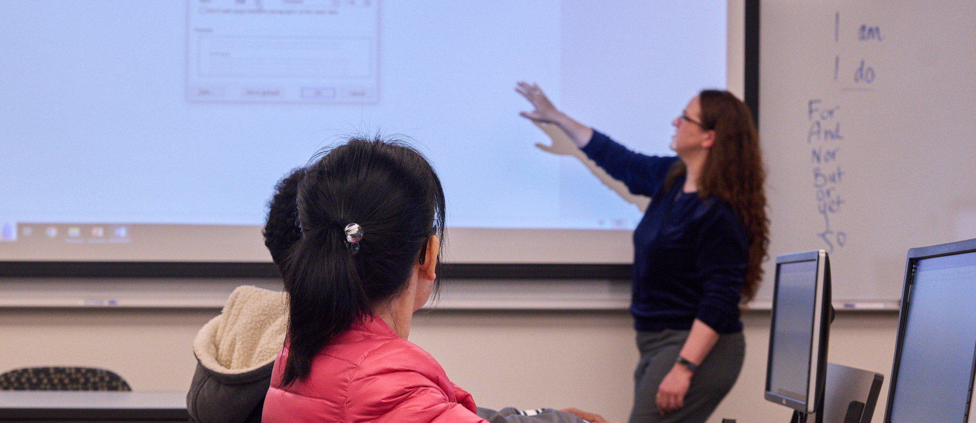 A student reading in front of a computer, demonstrating a focused and studious approach to online learning or research. A student reading in front of a computer, demonstrating a focused and studious approach to online learning or research.