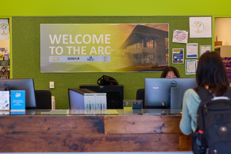 Health and Wellbeing A student resting and taking a break after a workout session at the gym.