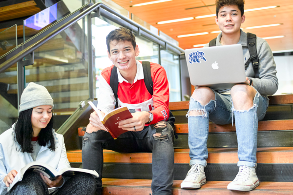 Running Start Smiling students sitting on the stairs
